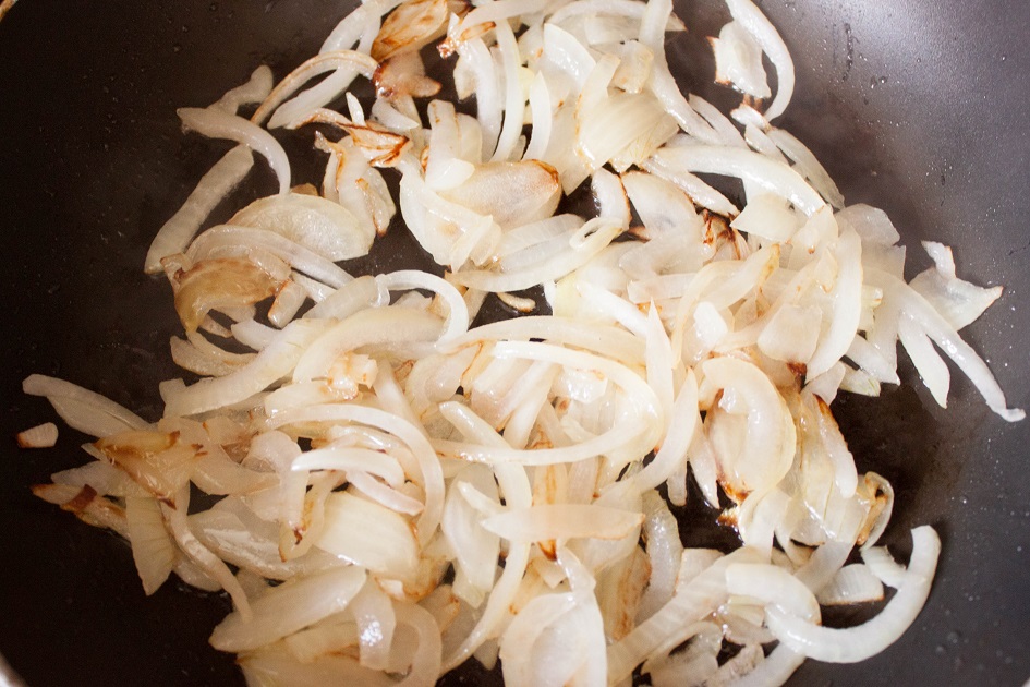 Fry the sliced onions