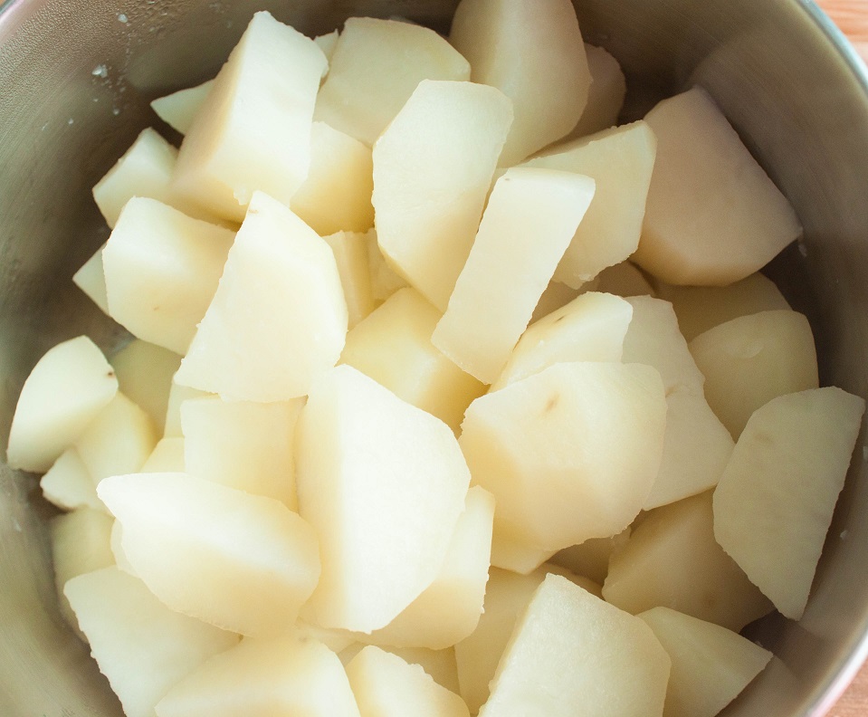 Peel, cut and boil the potatoes