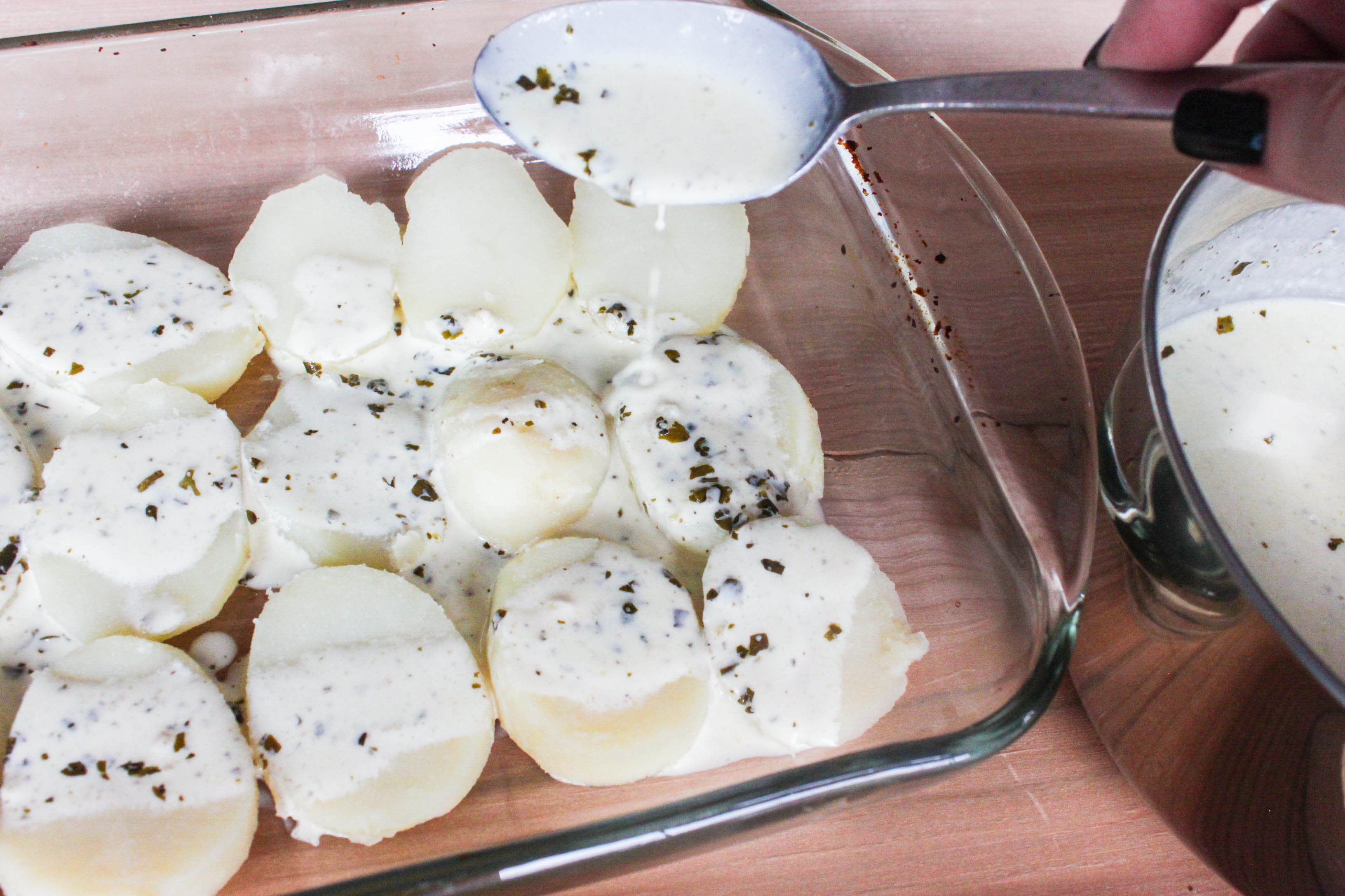 Baked potatoes with creamy pesto sauce