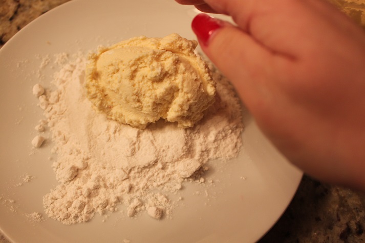 gently roll the cheese in a flour to make a ball